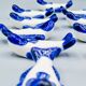 Set of 11 vintage blue and white porcelain fish knife rests.