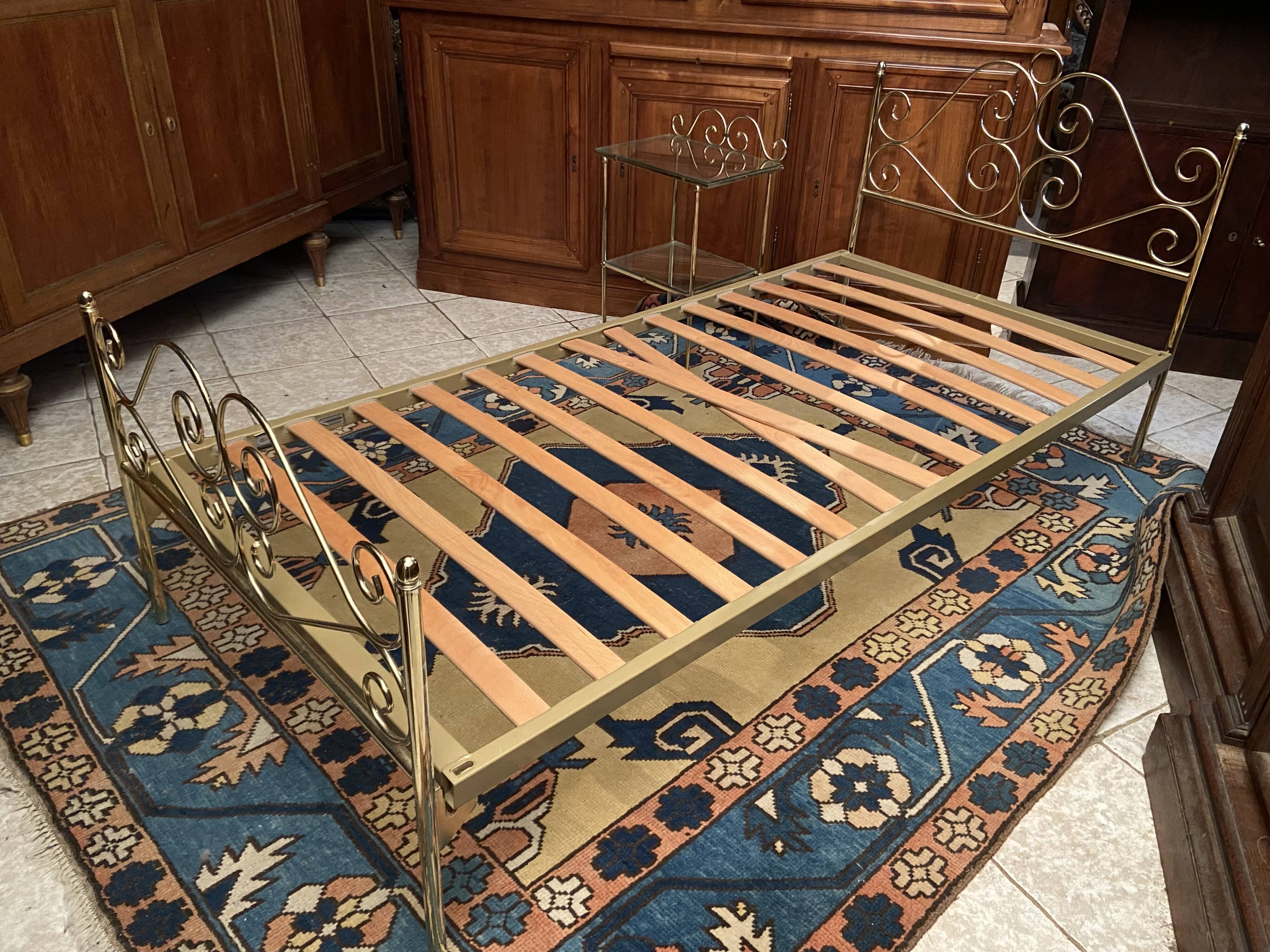 Romantic style single bed in brass with bedside table