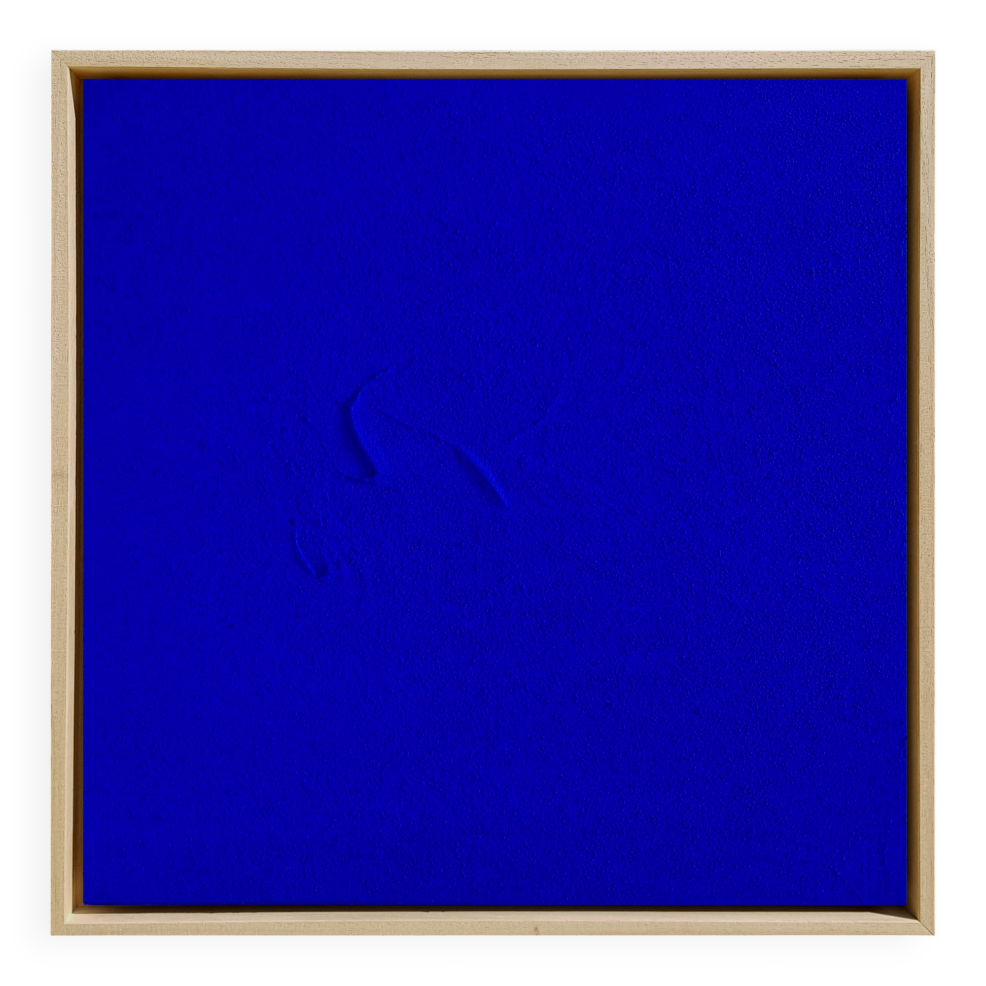 Framed monochrome blue abstract painting.