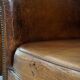 Set of 2 subtle, stately and sturdy club chairs made of sheepskin