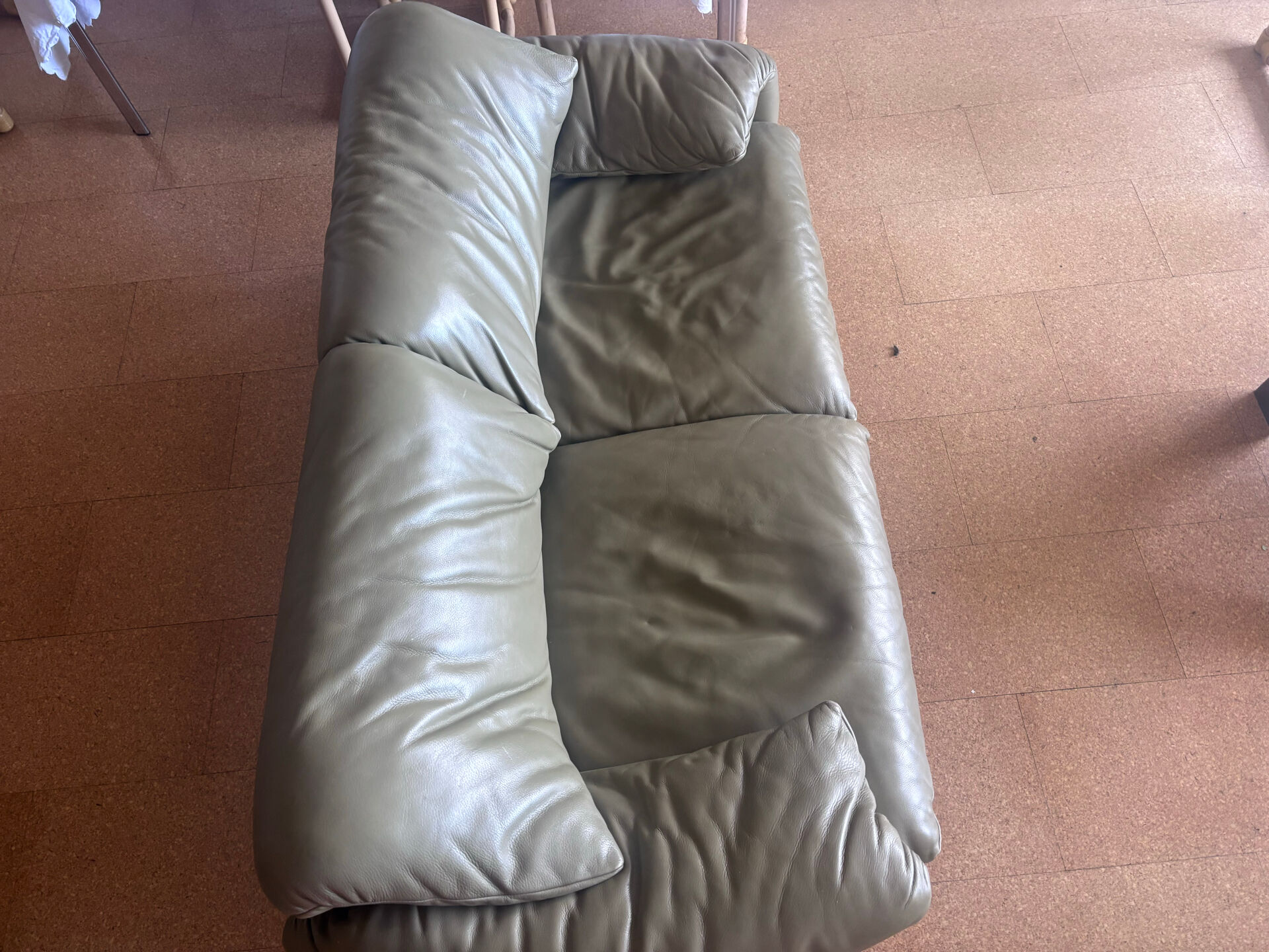 Two-seater Maralunga sofa in olive green leather.
