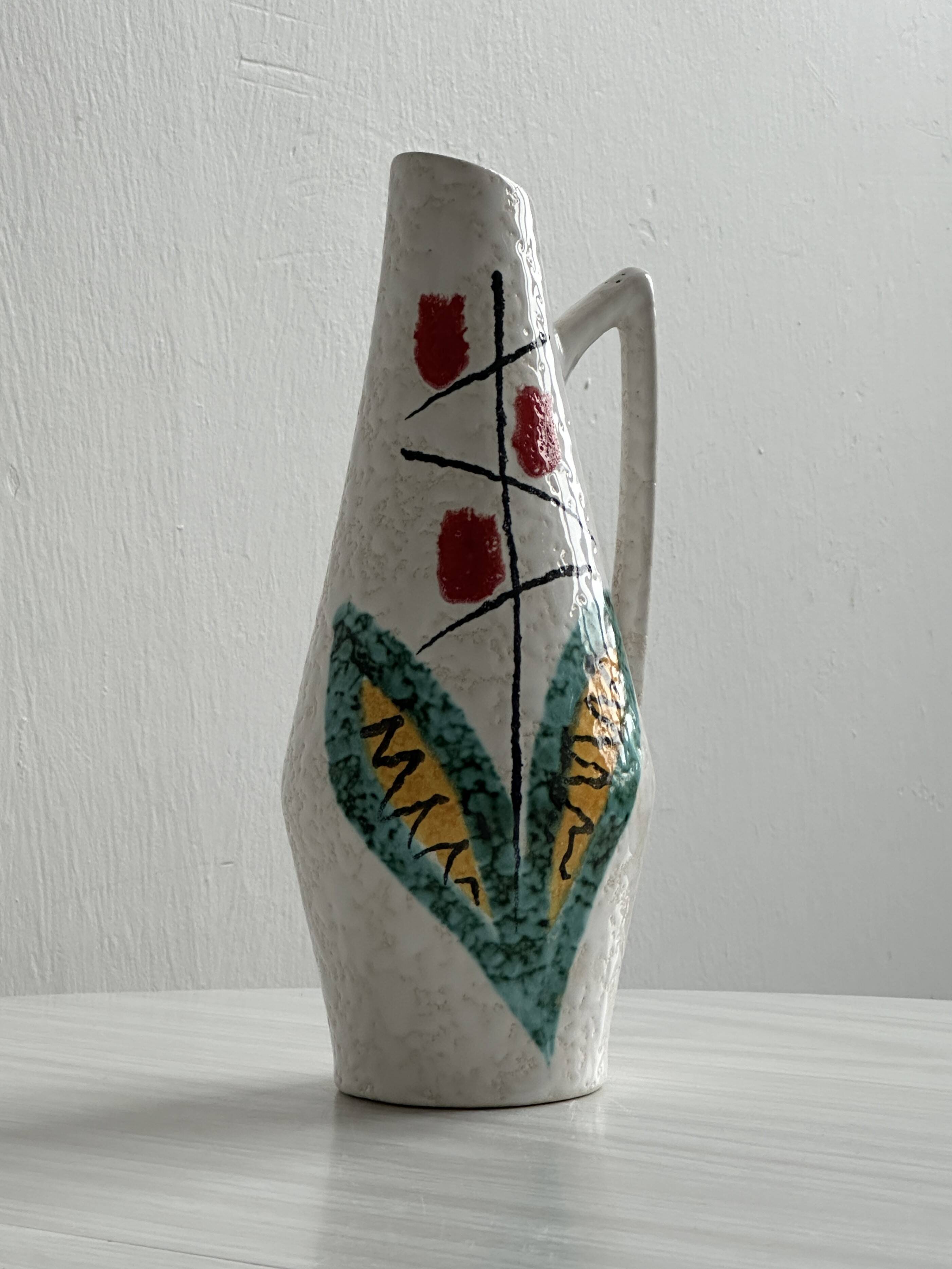 Ceramic flower pitcher.