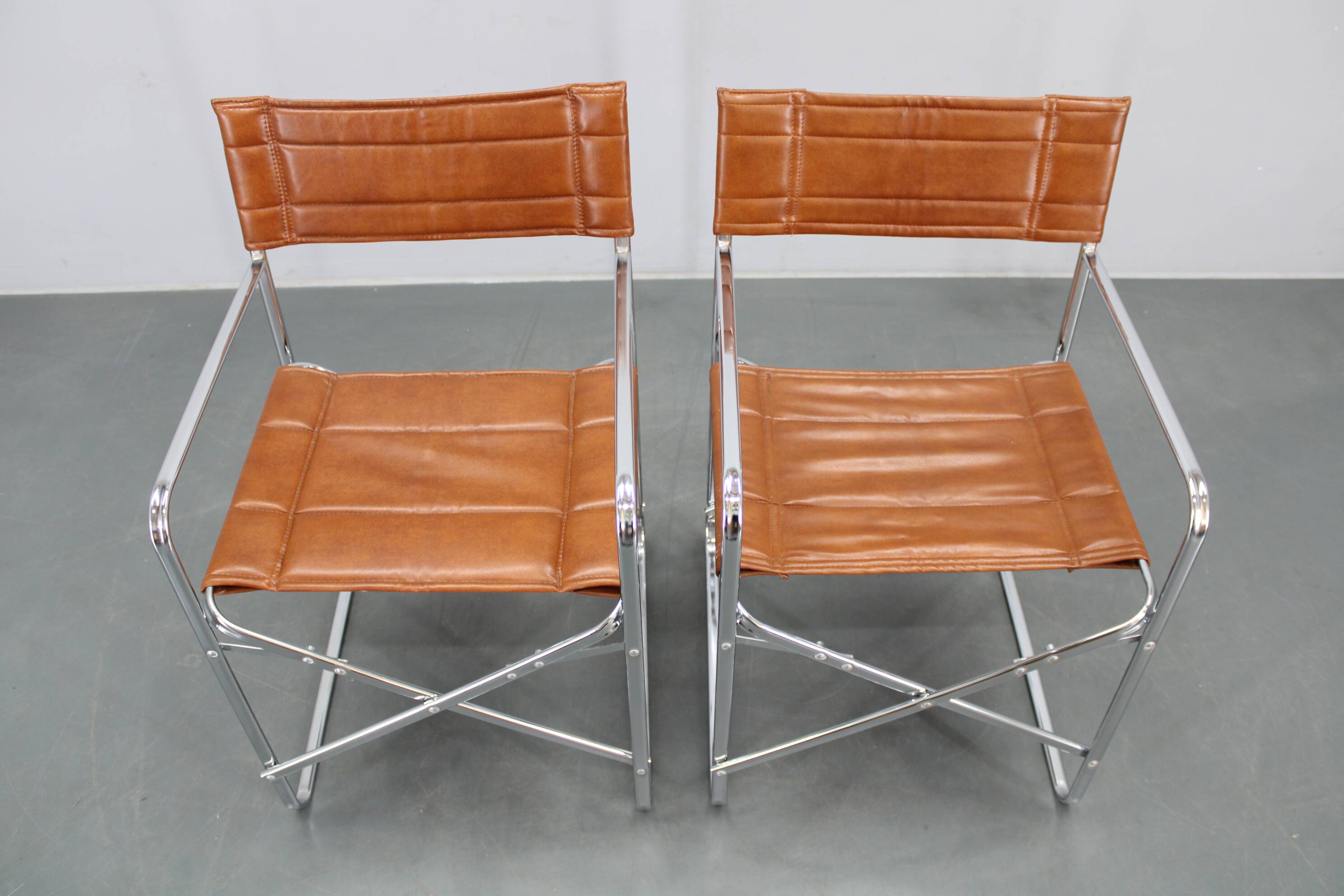 1970s pair of Italian folding chairs with leatherette upholstery