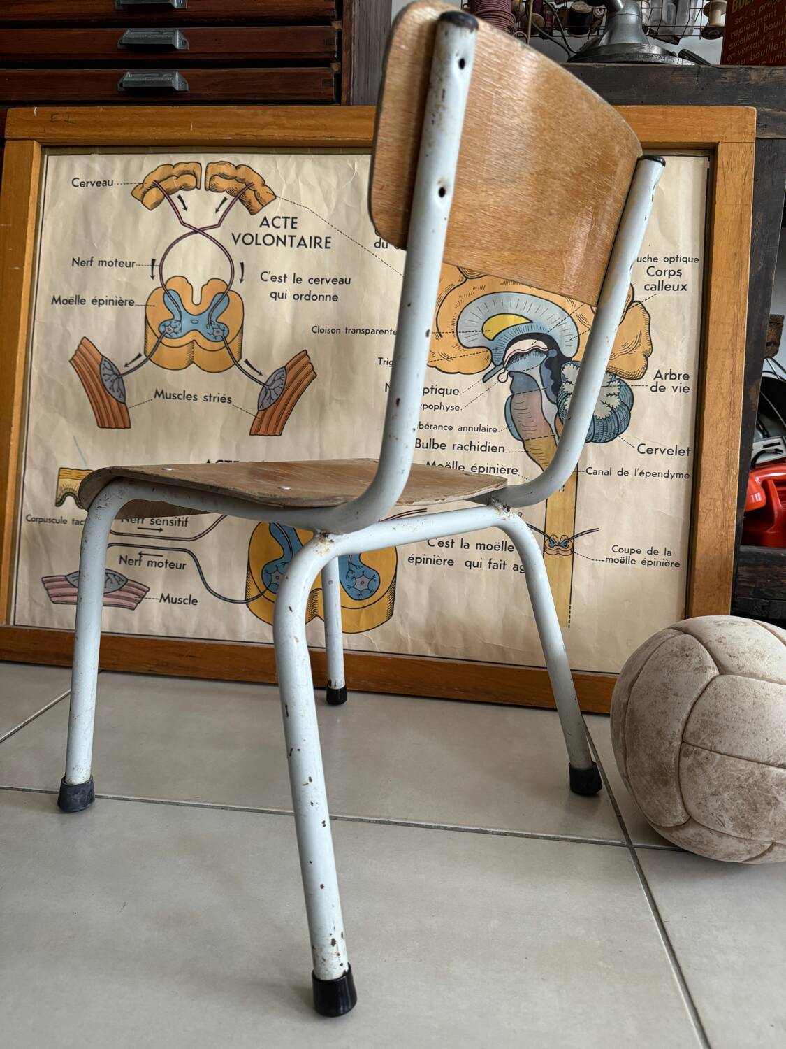 Old wooden and metal children's school chair