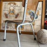 Old wooden and metal children's school chair