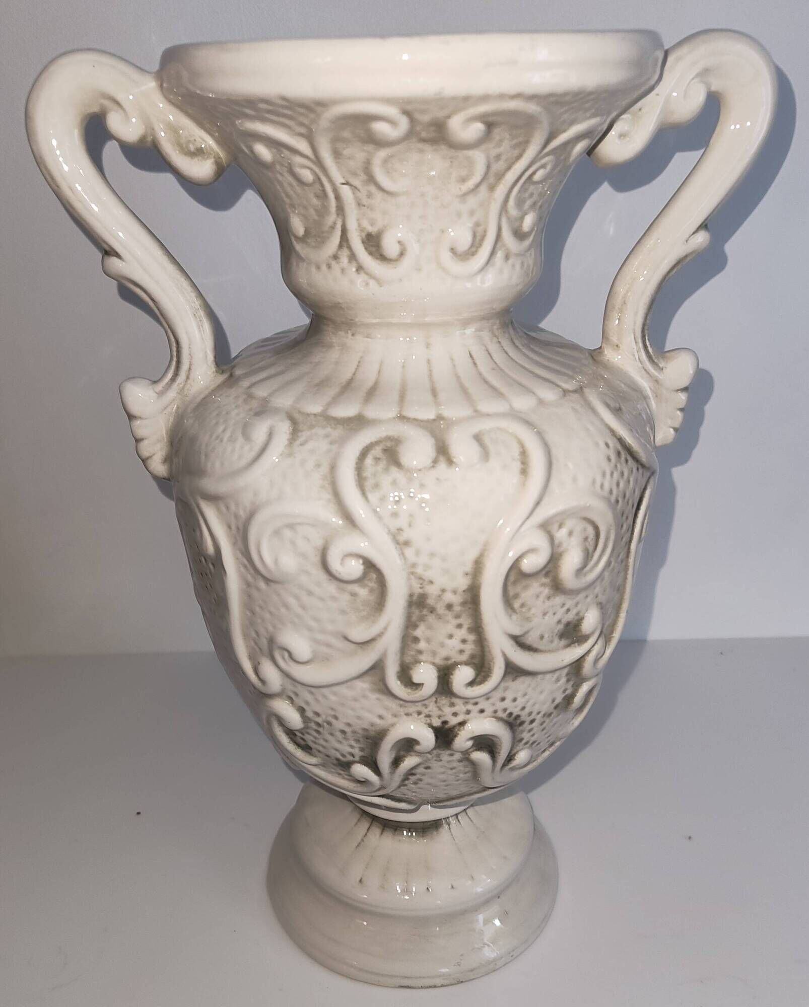Vintage Italian white ceramic vase with raised floral decoration.