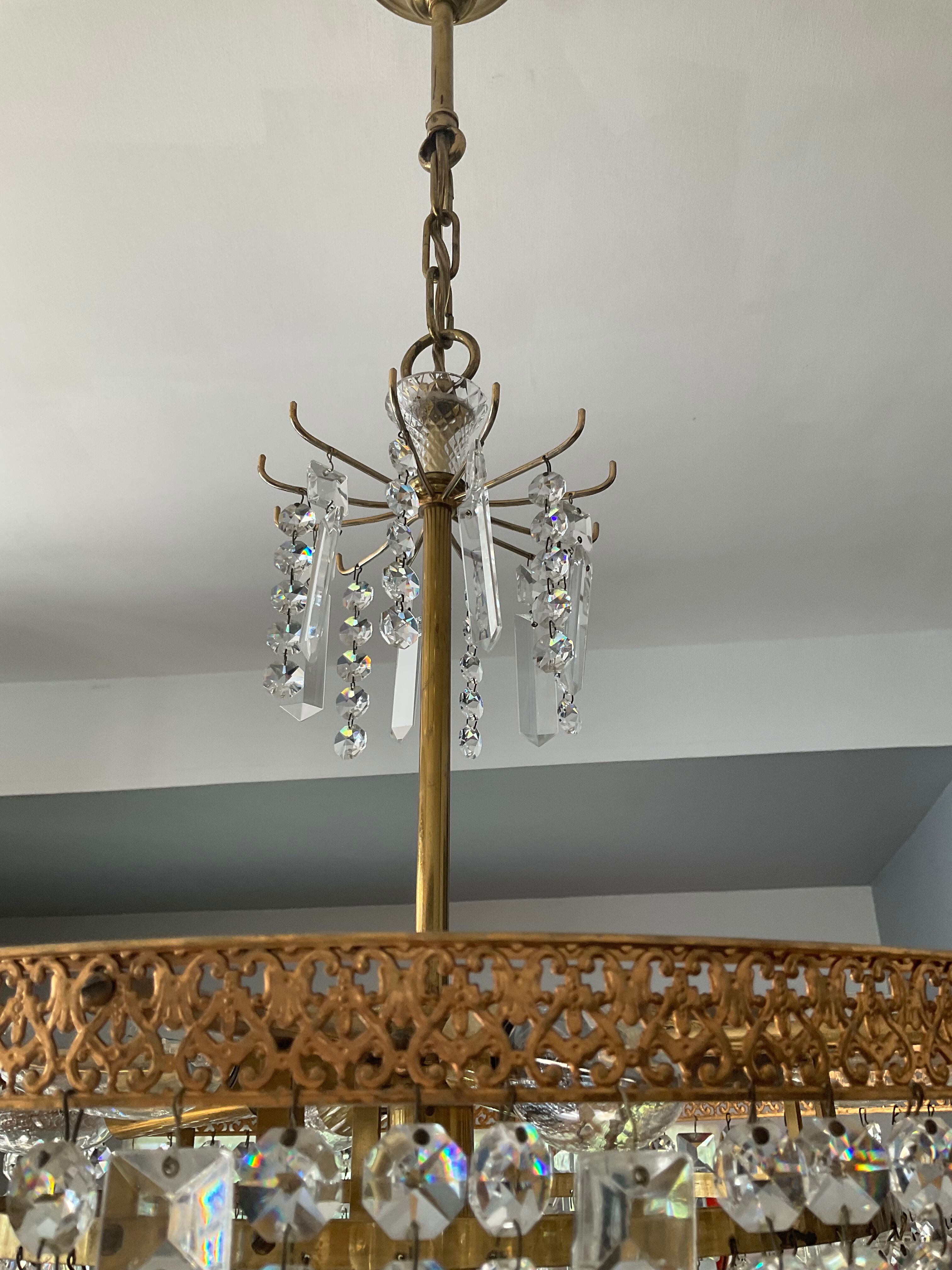 Old brass chandelier and crystal grapevines