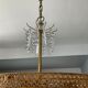 Old brass chandelier and crystal grapevines