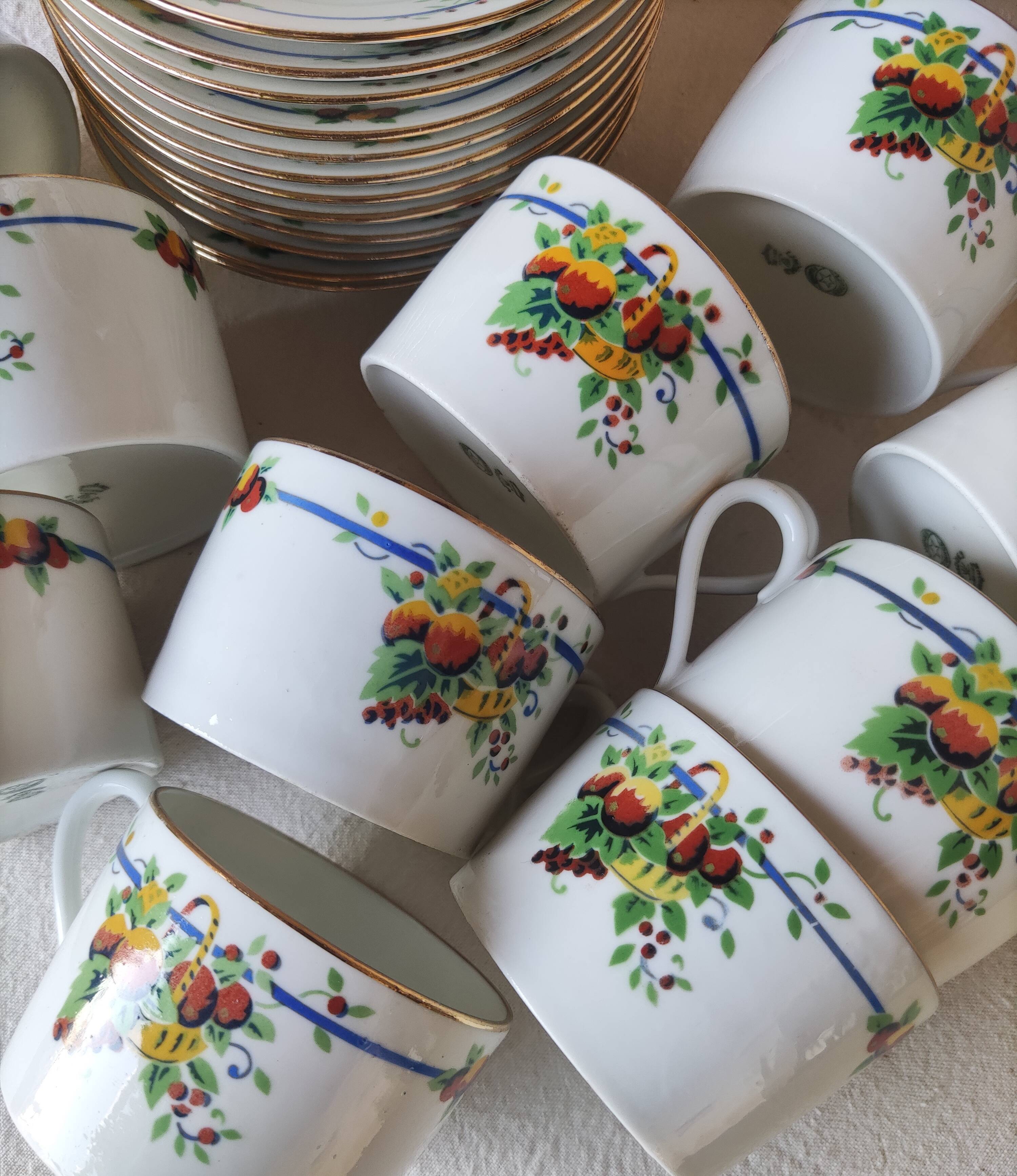 10 tea cups and creamer in Limoges porcelain