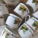 10 tea cups and creamer in Limoges porcelain