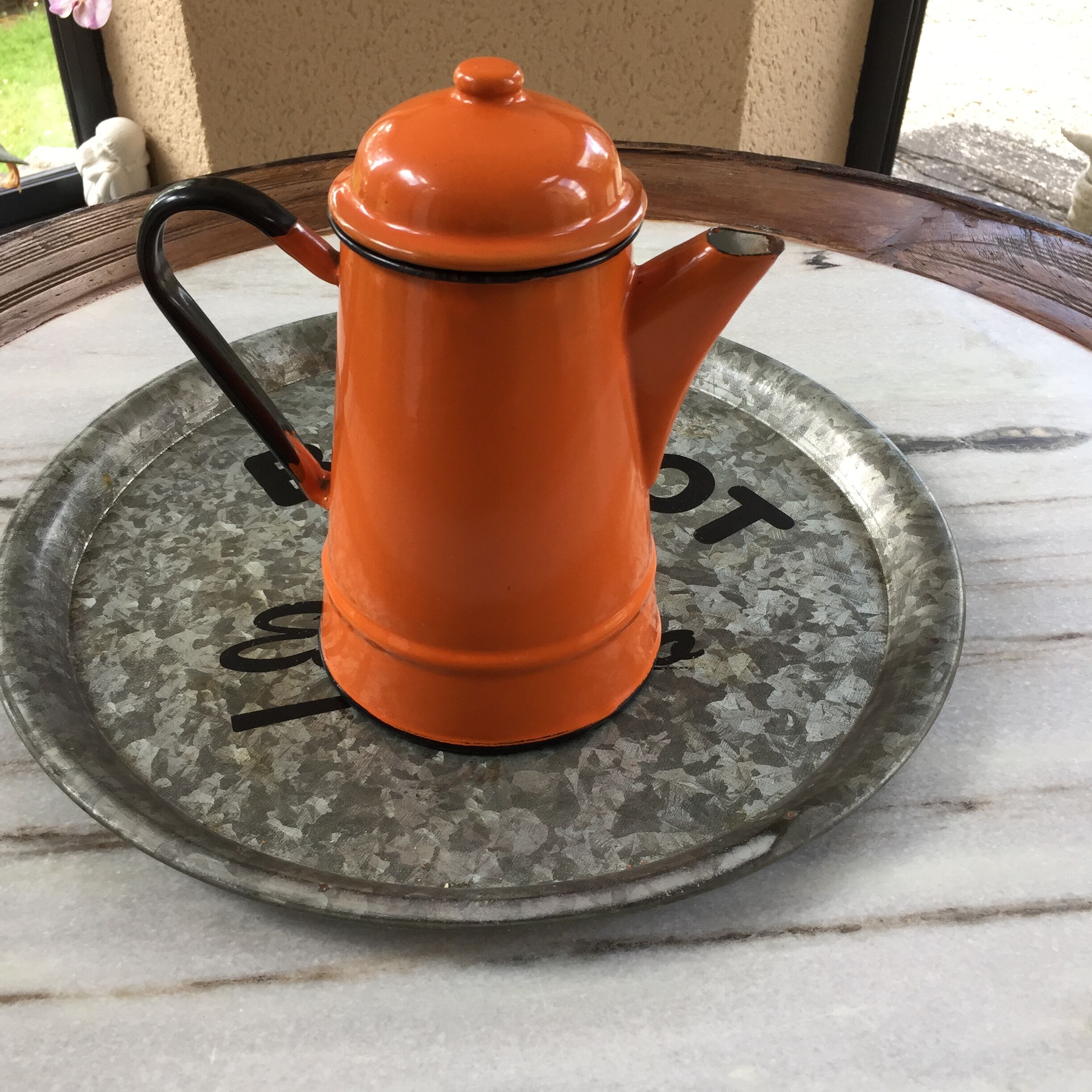 Orange and black enamelled sheet metal coffee maker