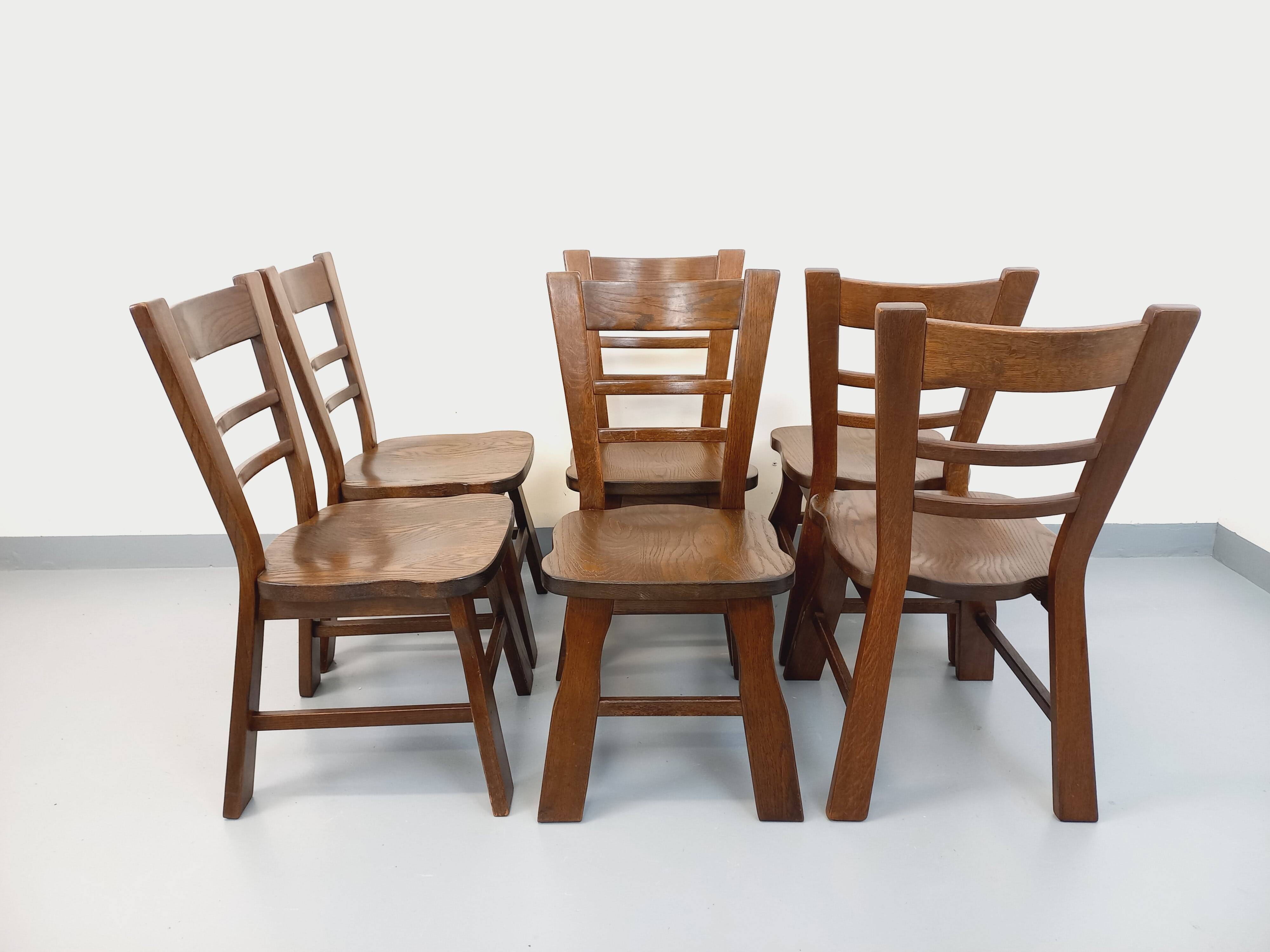 Set of 6 vintage brutalist oak chairs from the 1950s.