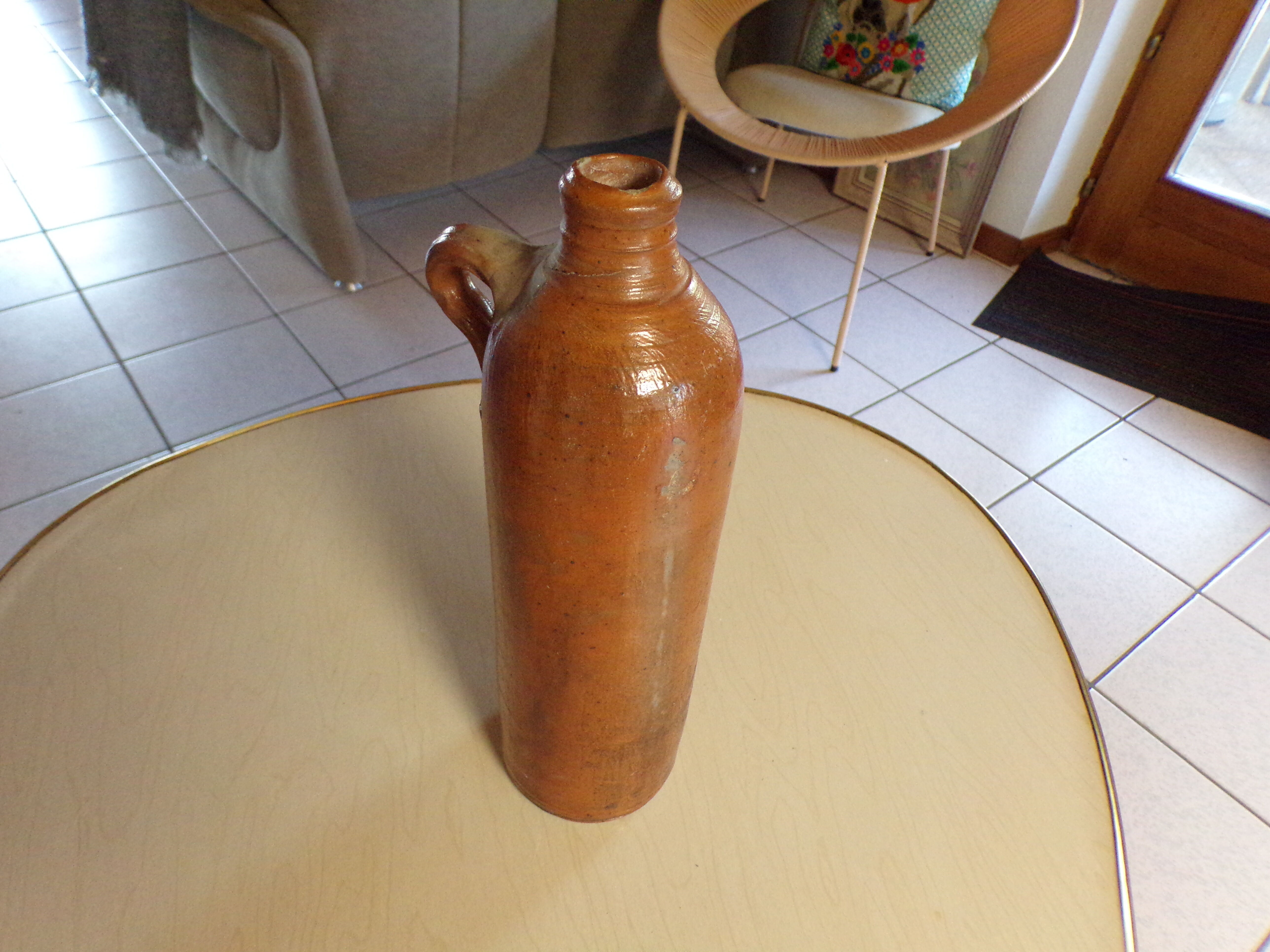 Old glazed terracotta bottle