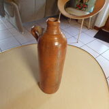 Old glazed terracotta bottle