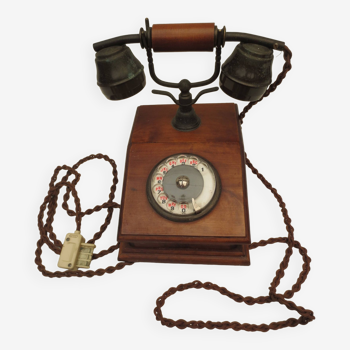 Old telephone with wooden base, well preserved