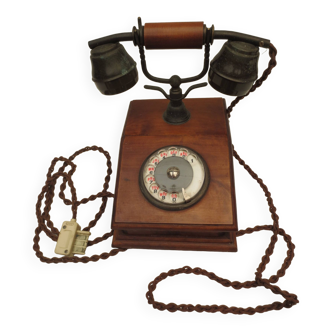 Old telephone with wooden base, well preserved