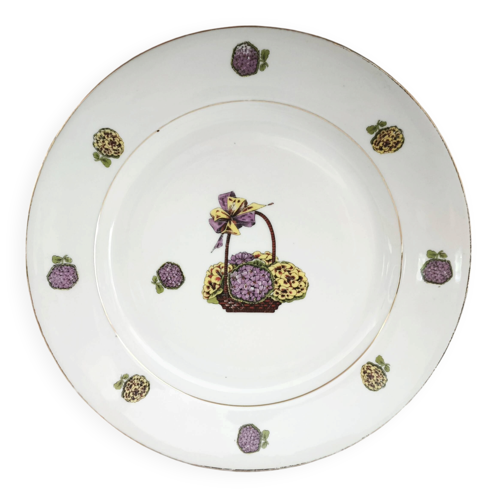 Round porcelain plate from Limoges with a hydrangea basket design.