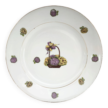 Round porcelain plate from Limoges with a hydrangea basket design.