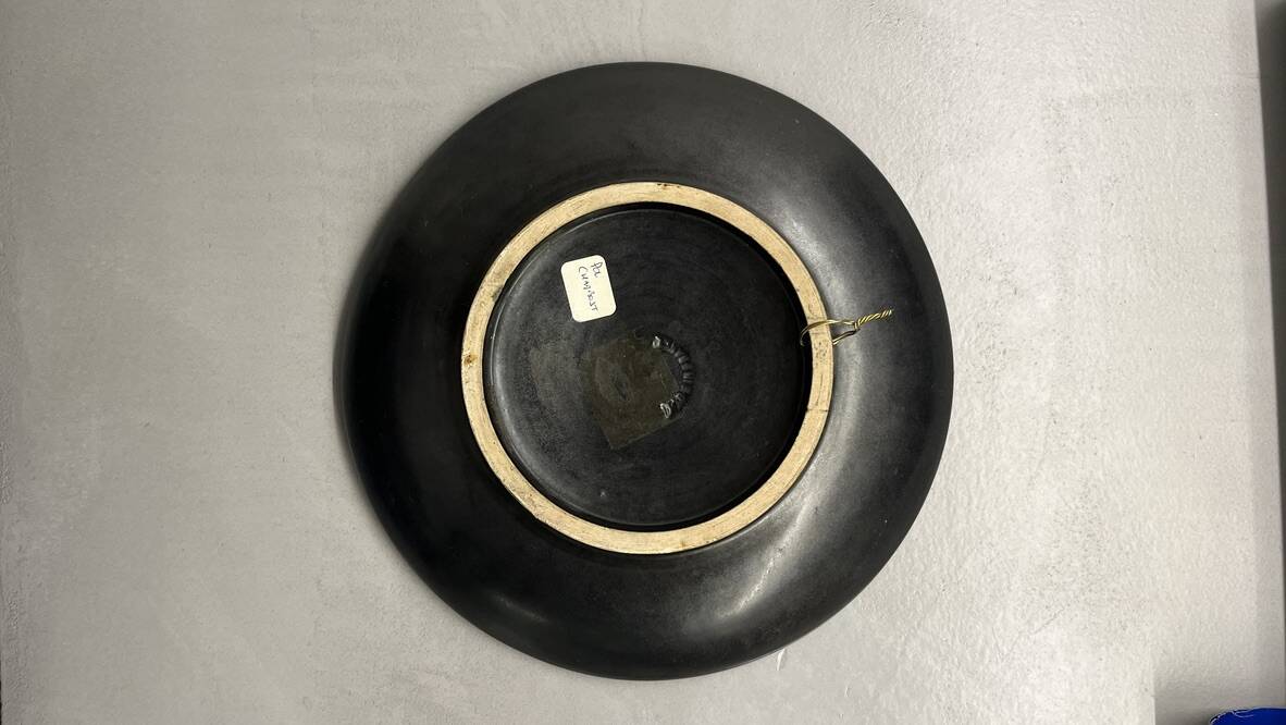 Wall plate by Pol Chambost with leaf pattern.