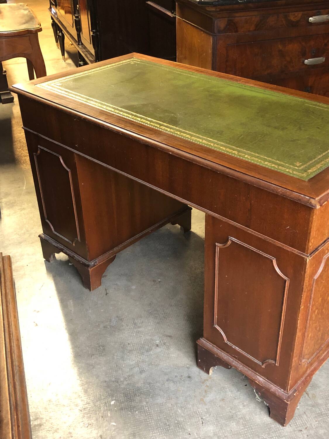English pedestal desk with green leather top