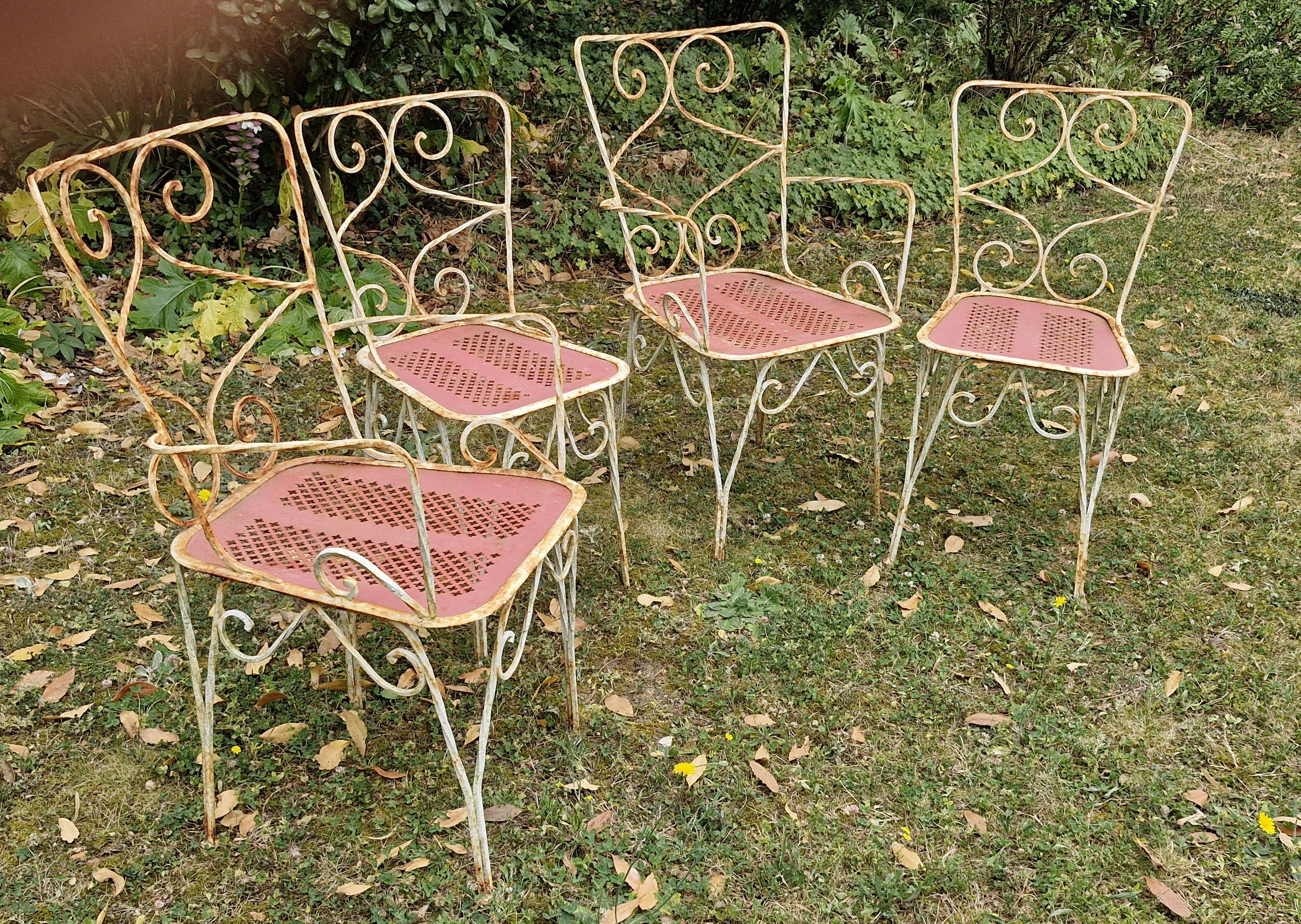 Perforated metal garden chairs and armchairs