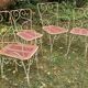 Perforated metal garden chairs and armchairs