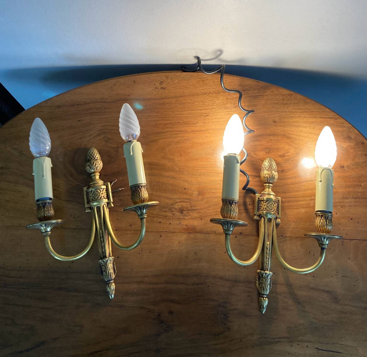St Louis XVI gilded bronze wall lights with foliage and pine cone decorations