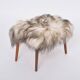 Danish Mid-century Modern stool reupholstered in white and black sheep skin