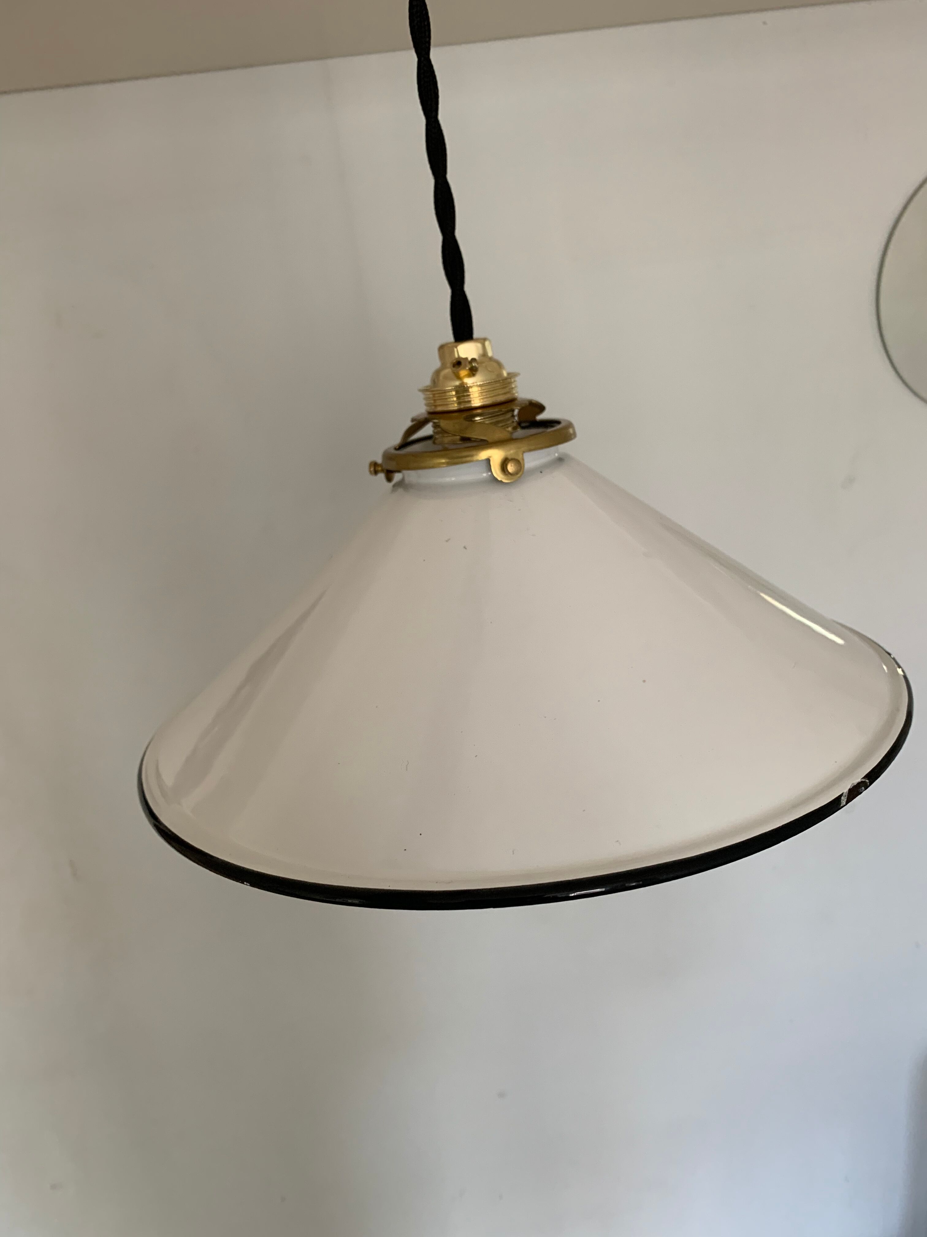 Old pair of white industrial metal suspensions with black border