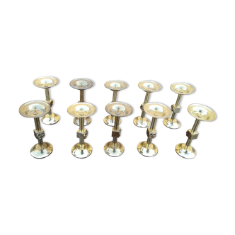 Lot of ten peaks candles in brass