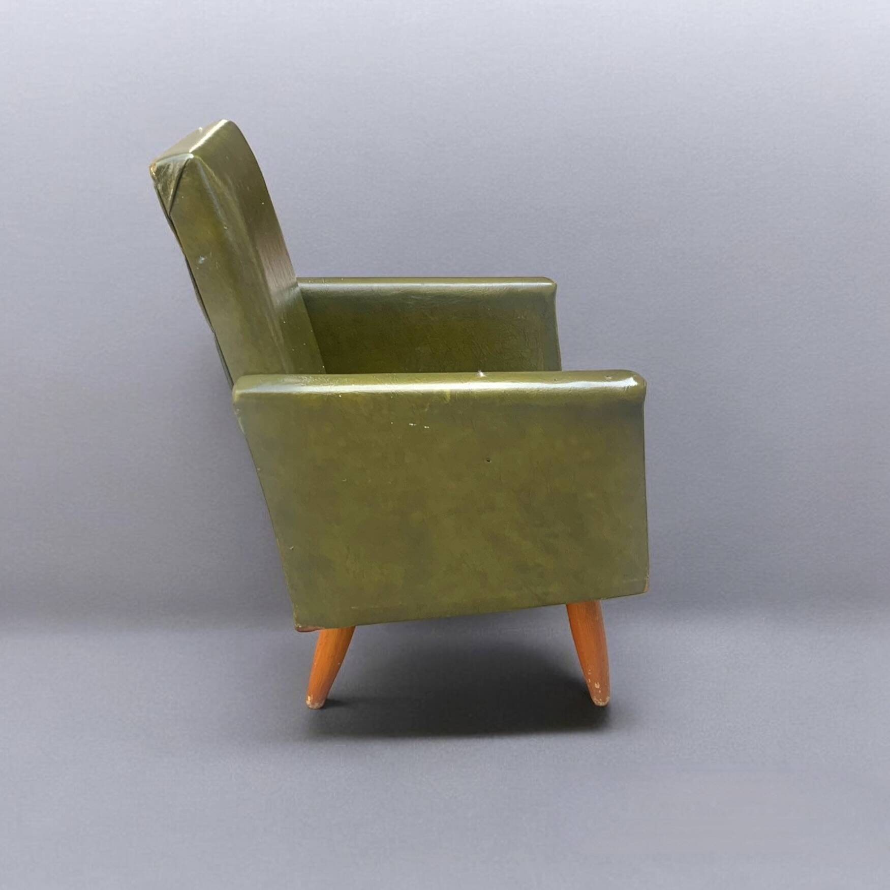 Vintage children's armchair in green skai