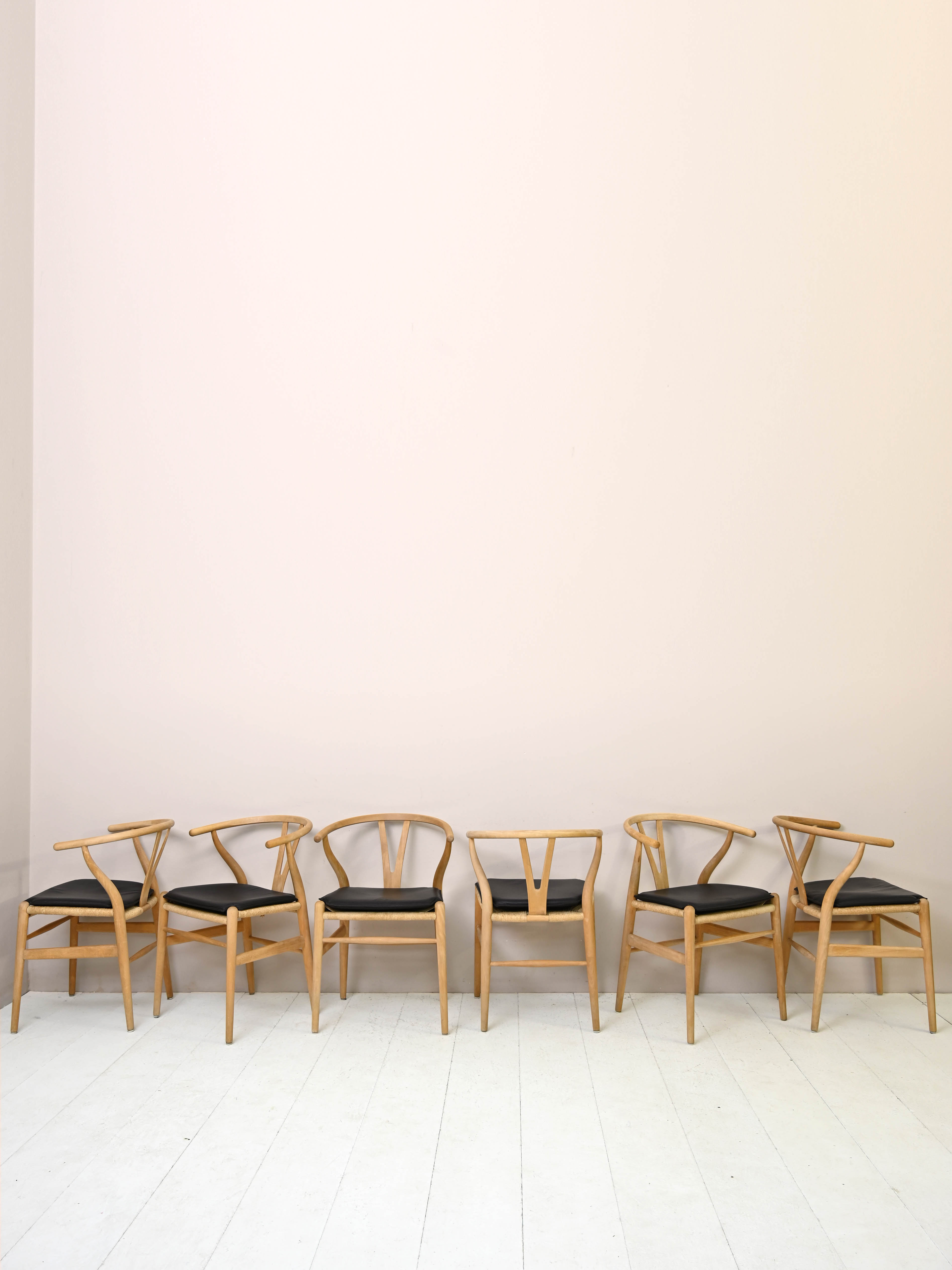 Set of six 'Wishbone chair' model chairs by Hans J. Wegner with leather cushions