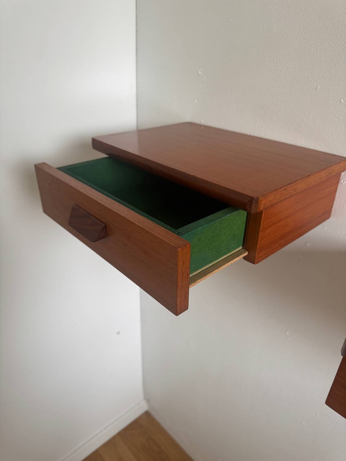 Vintage Scandinavian teak wall-mounted bedside tables.