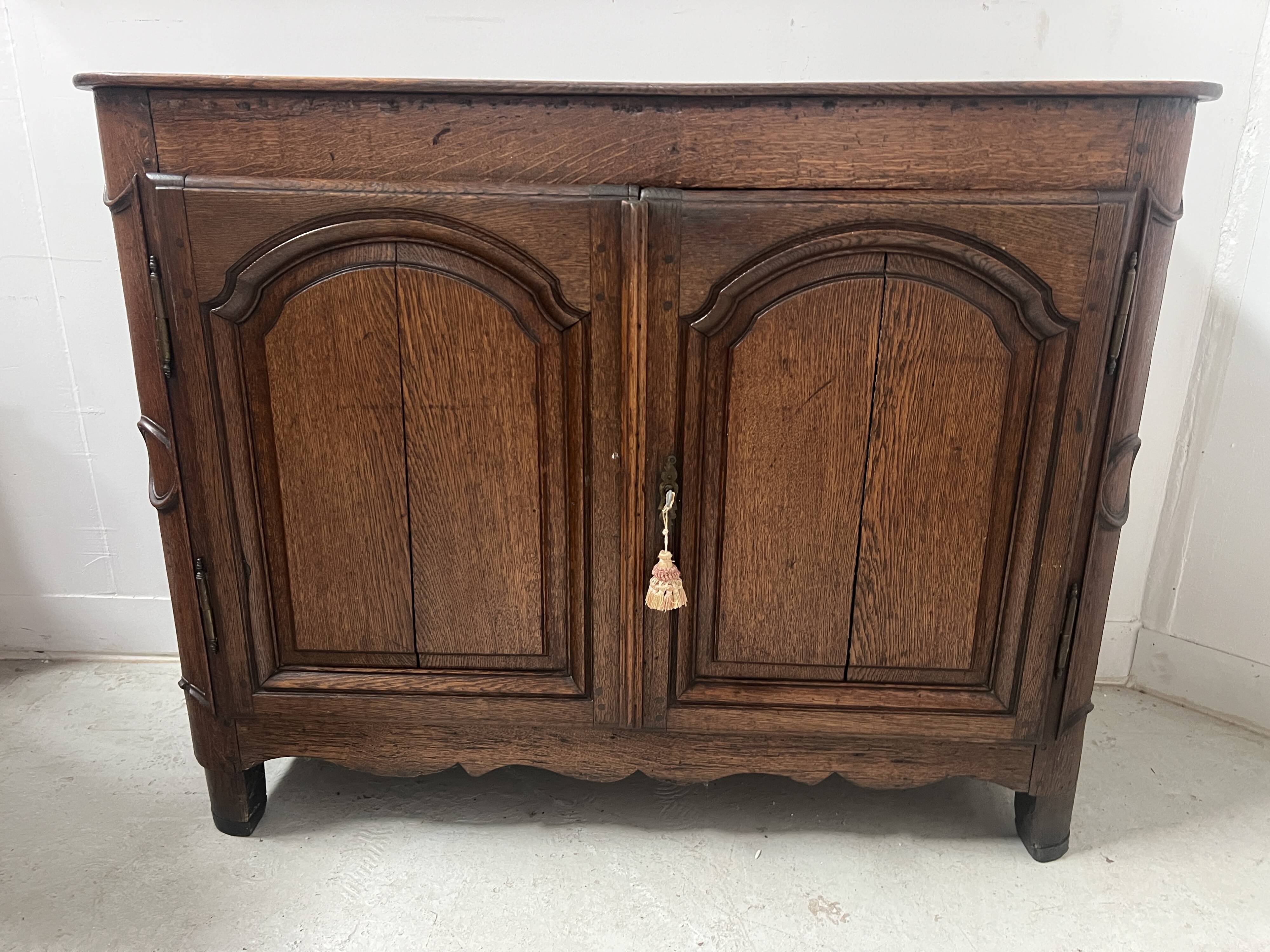 Two-door buffet in solid oak, Louis XIV style, 18th century.