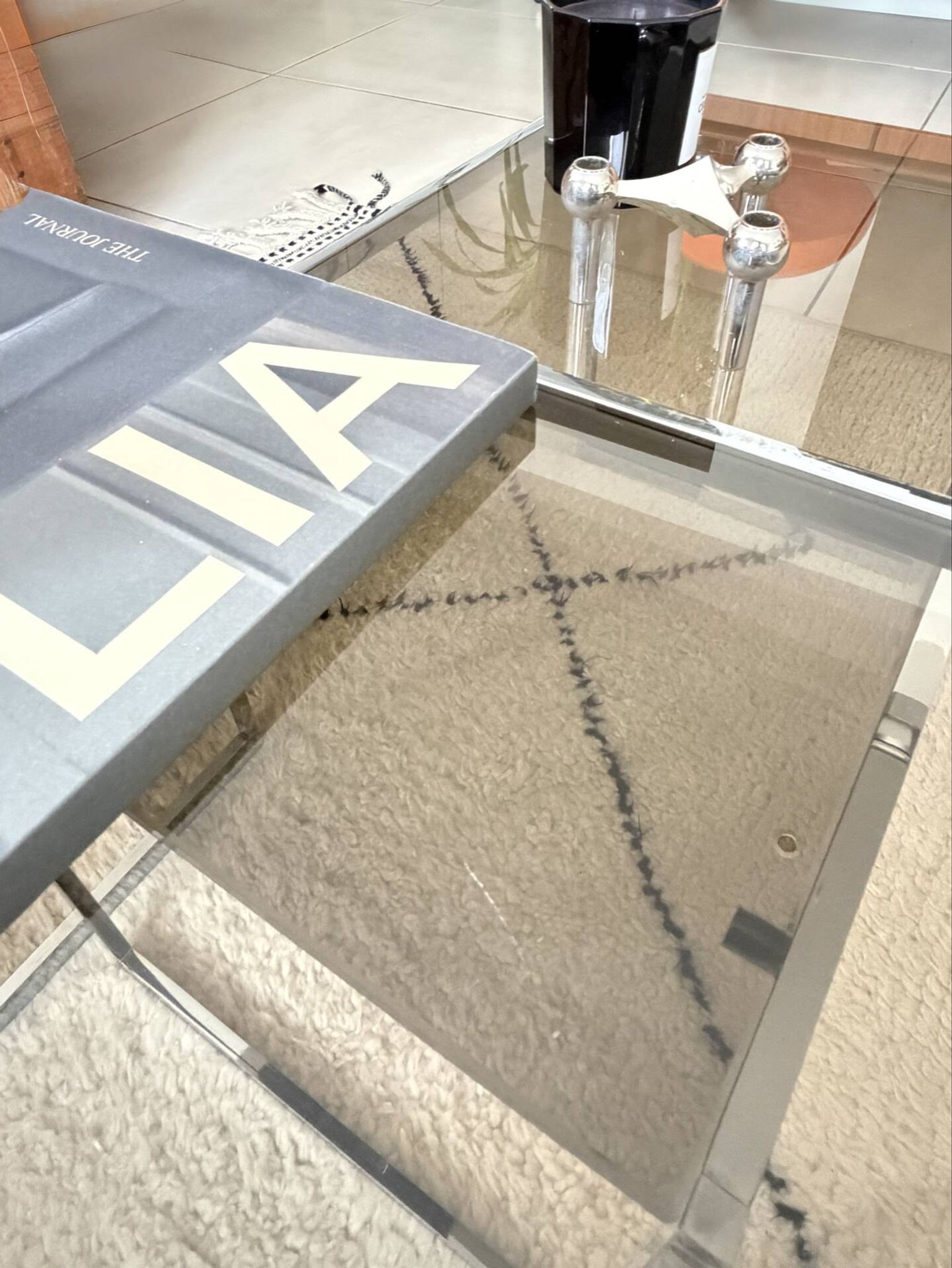 Set of 2 vintage nesting coffee tables in chrome metal and smoked glass.