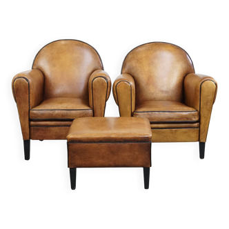 Ensemble de 2 fauteuils et un pouf en cuir de mouton