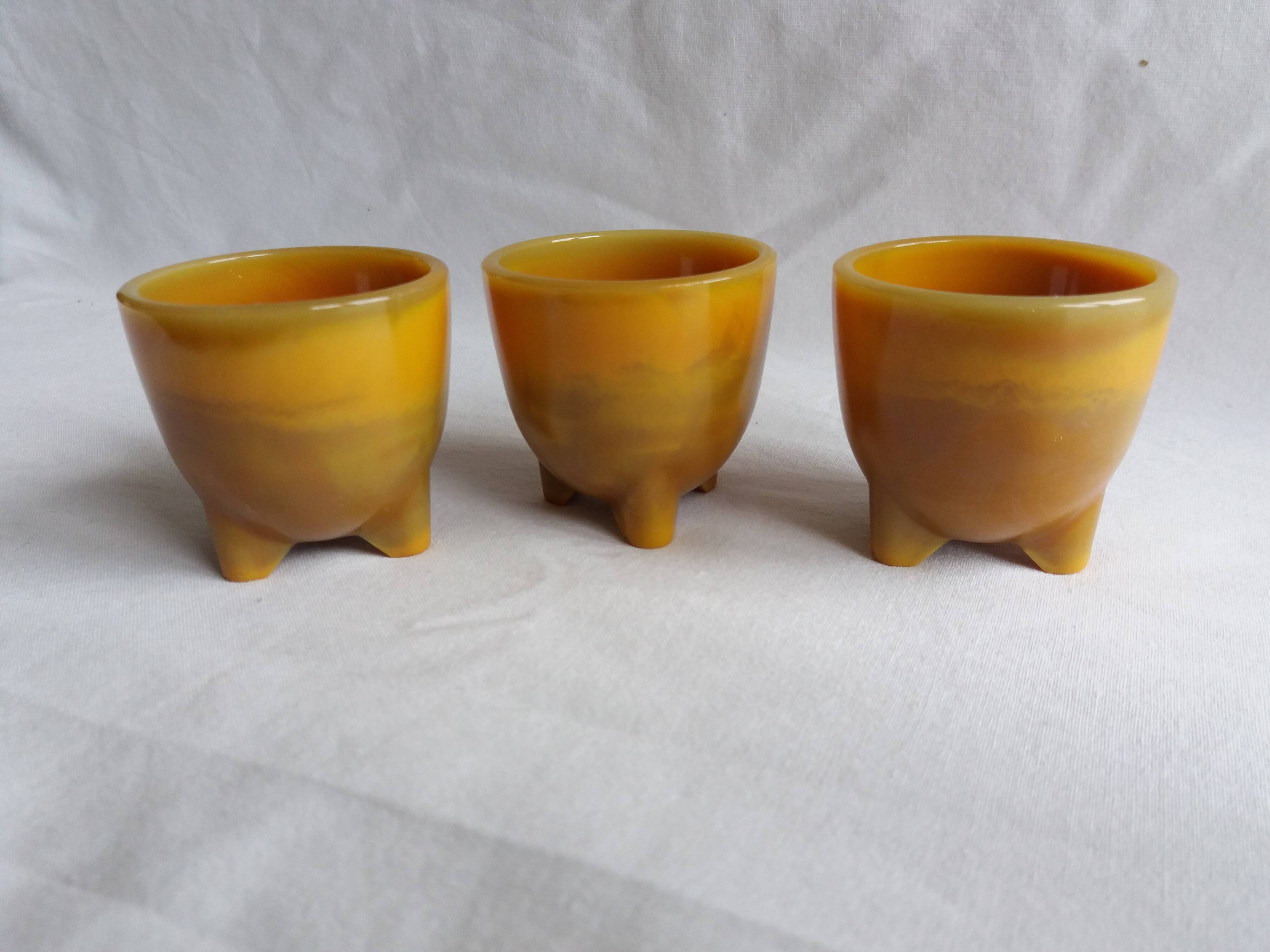 Marbled glass tripod egg cups