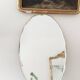 Large oval beveled faceted mirror, 48 x 30 cm