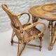 Vintage Audoux Minet bamboo, rattan, and smoked glass table duo.