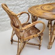 Vintage Audoux Minet bamboo, rattan, and smoked glass table duo.