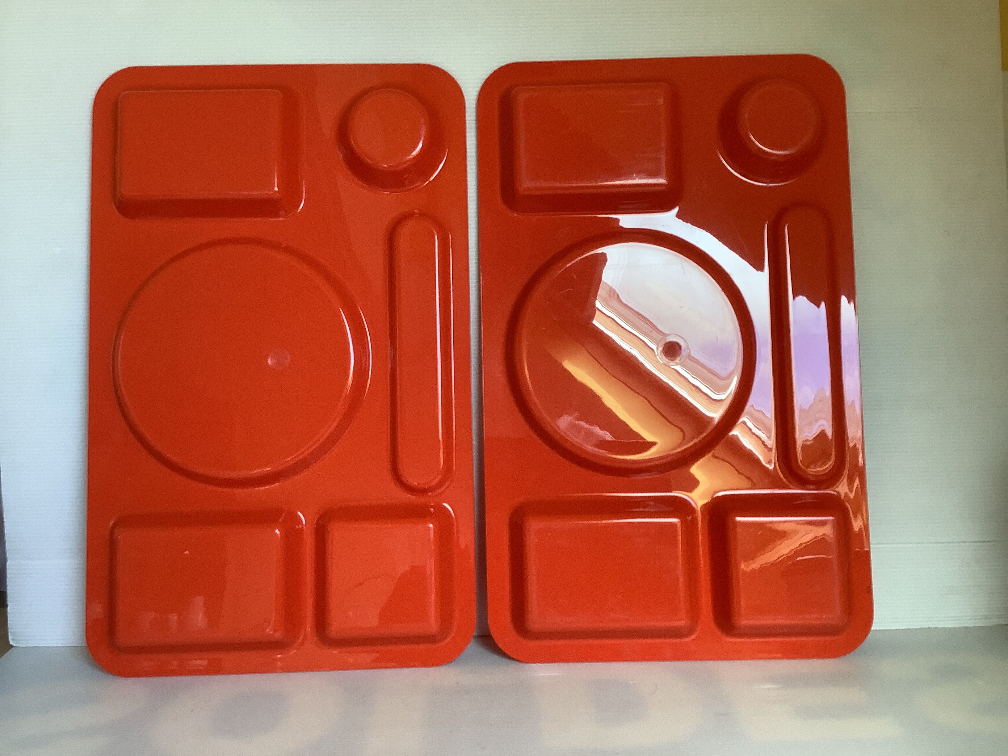 Pair of orange guzzini meal trays