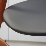 Vintage armchair in teak and black leather model Casina 60s