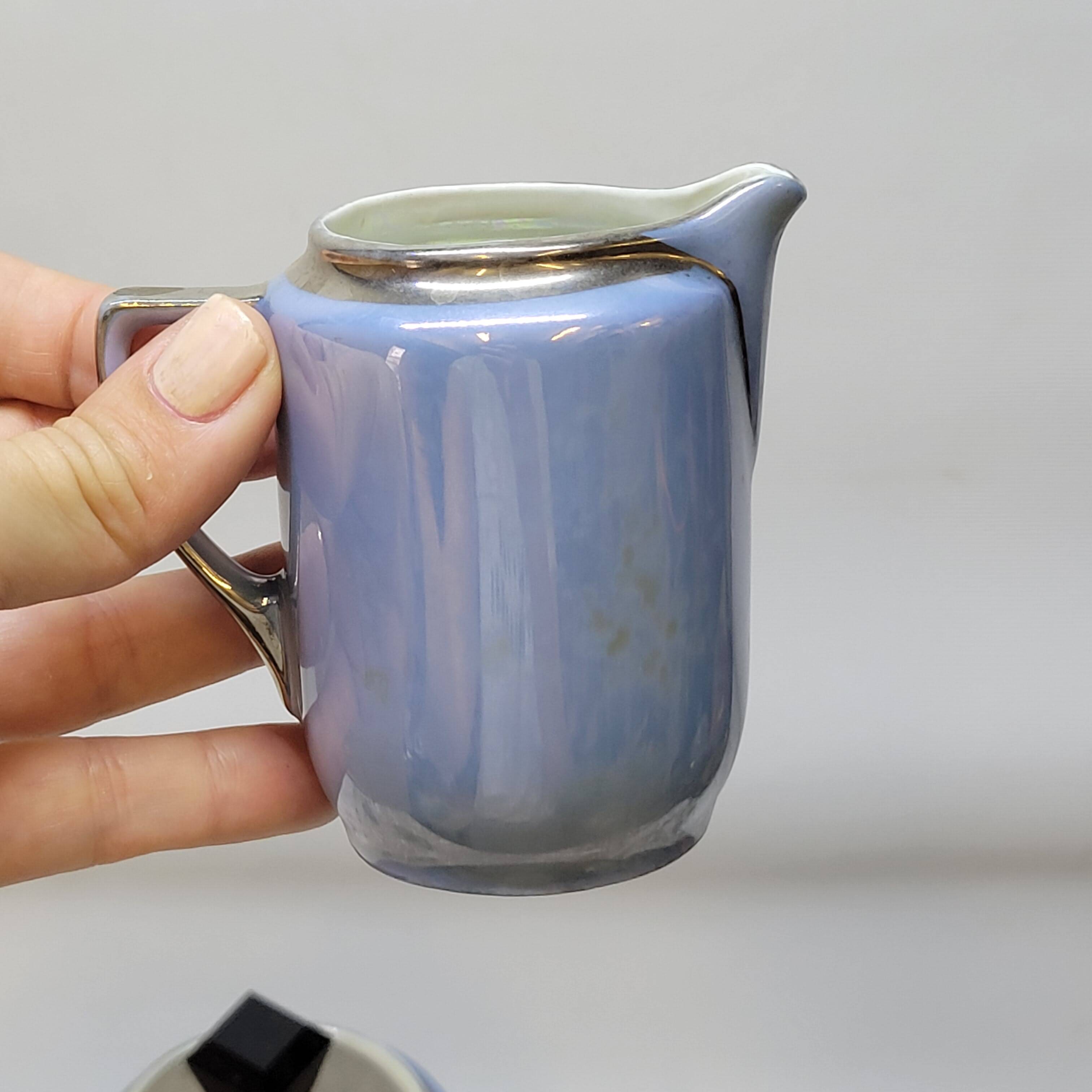 Art deco coffee service in fine iridescent blue porcelain, metal and wood