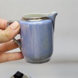 Art deco coffee service in fine iridescent blue porcelain, metal and wood