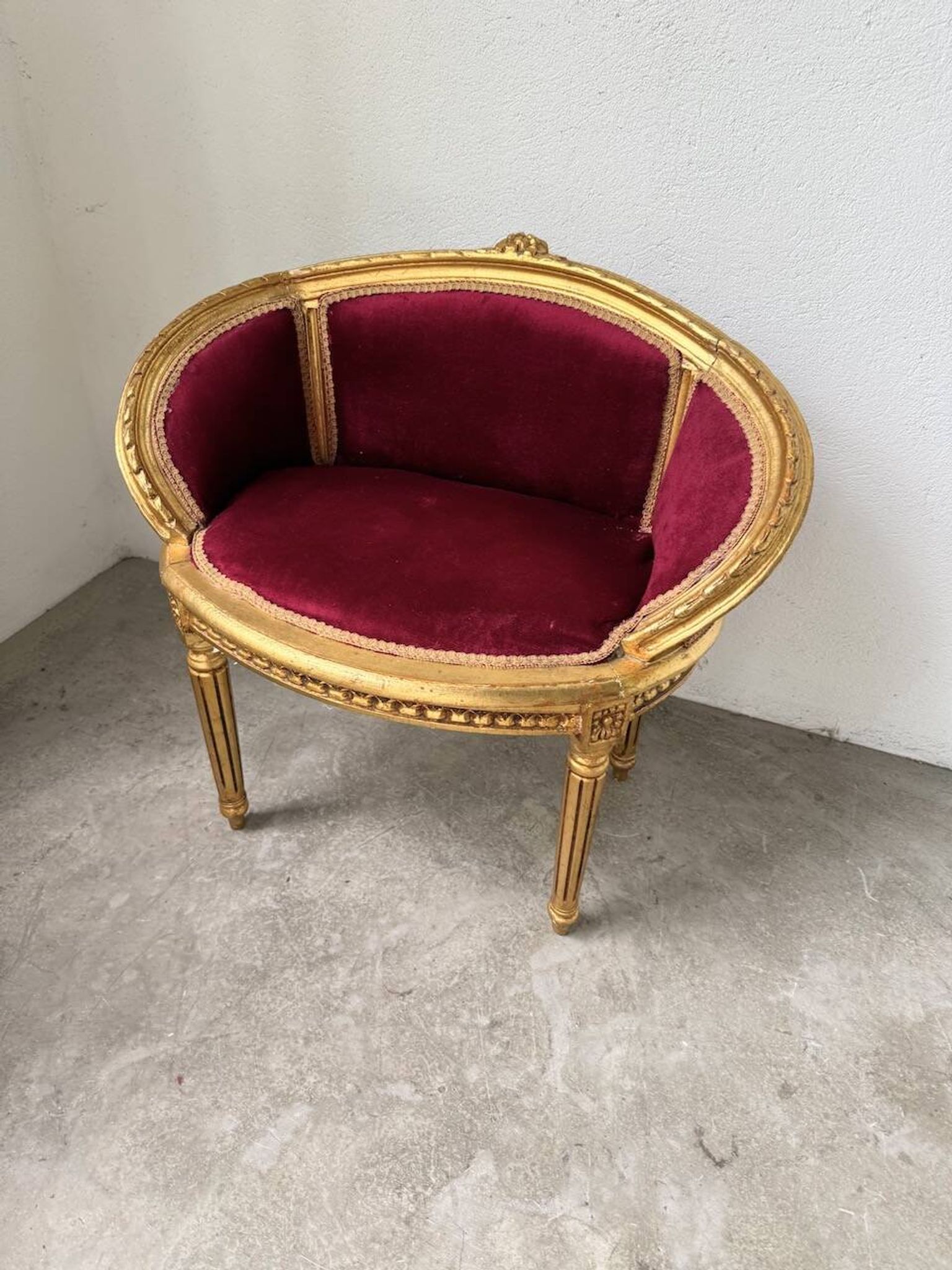 Louis XVI gilt wood and red velvet armchair