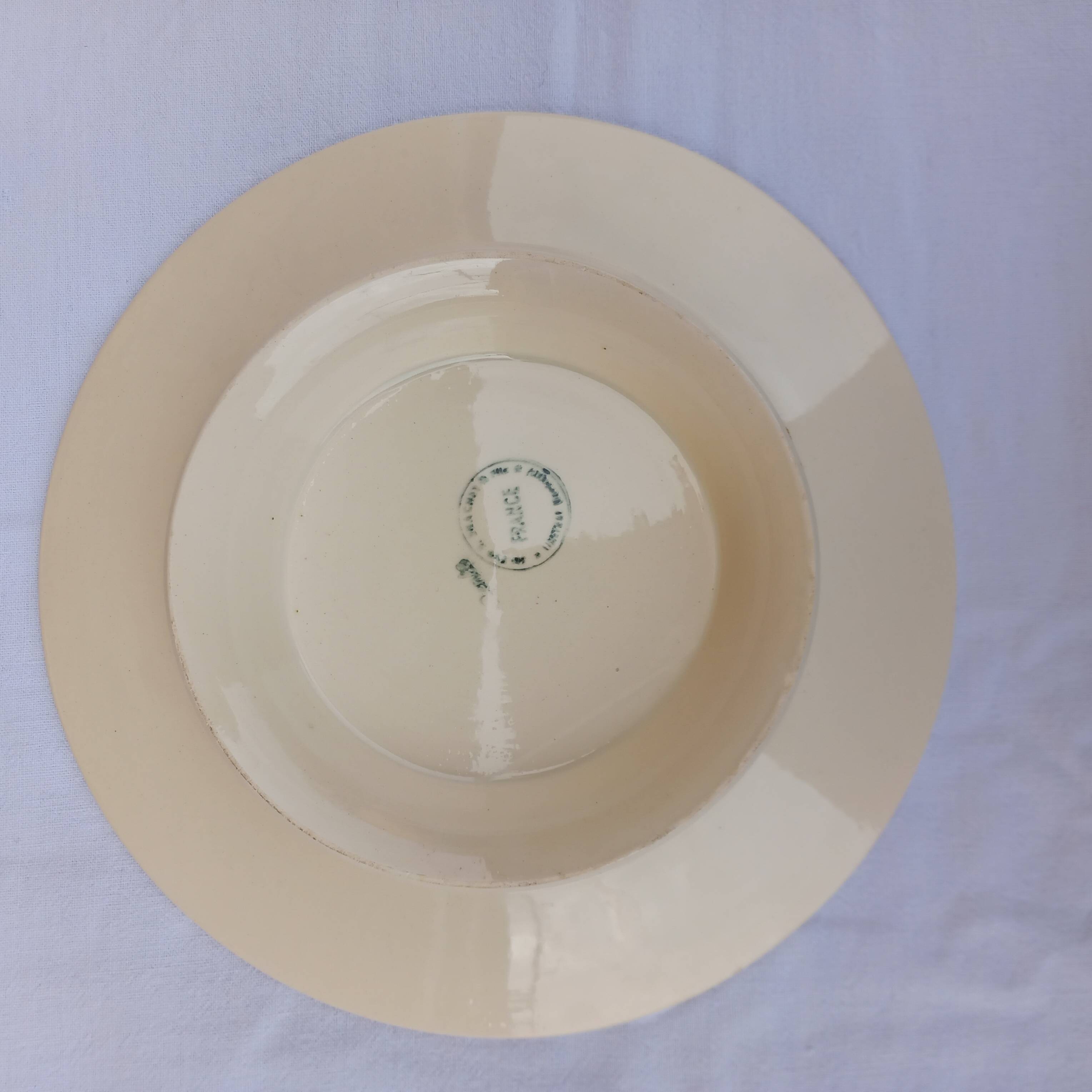 Old presentation plate on red rose foot