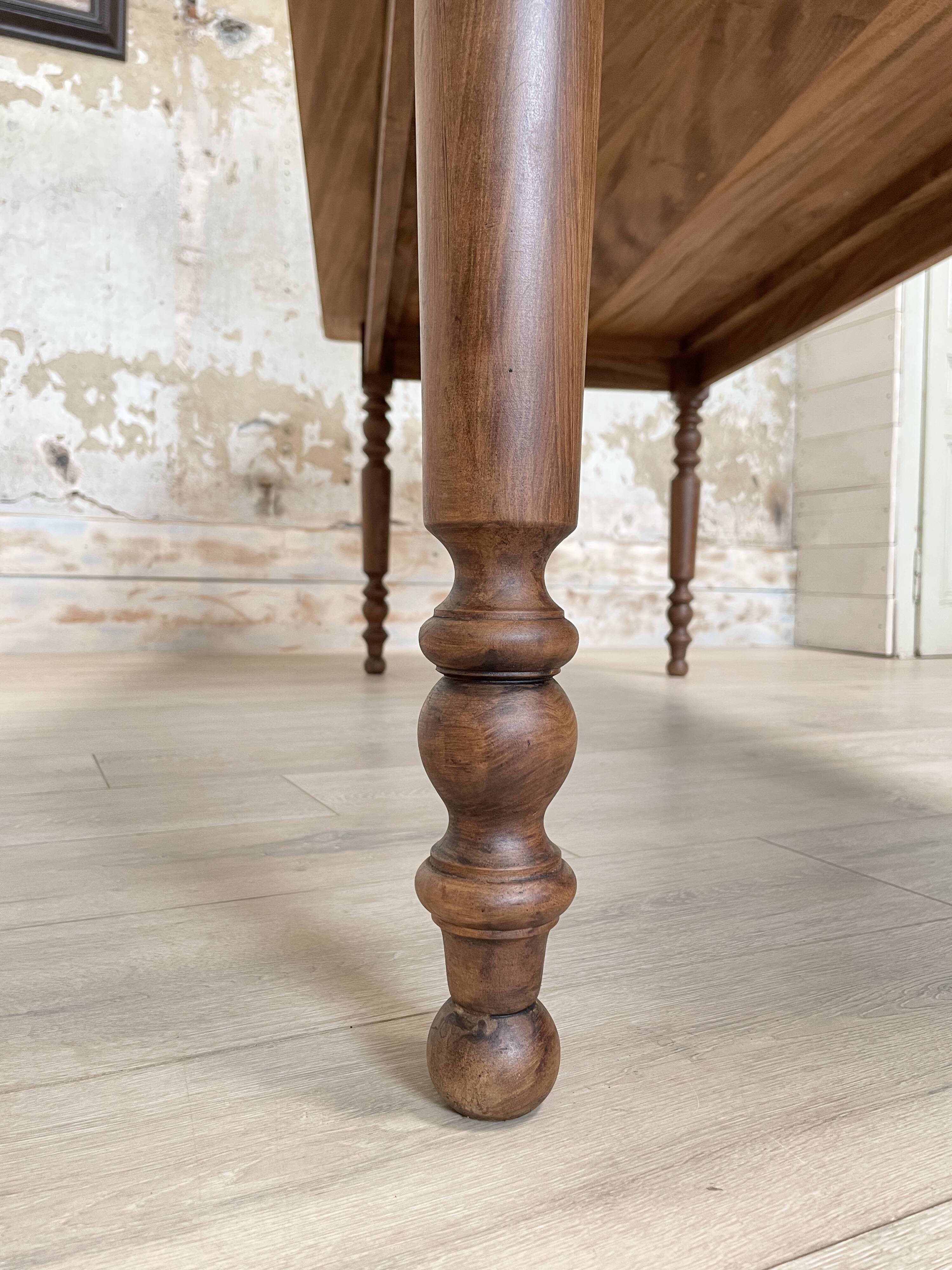 Vintage farmhouse table with turned legs.