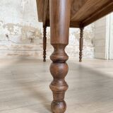 Vintage farmhouse table with turned legs.