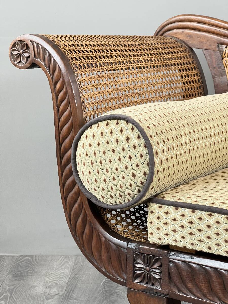 Louis XVI style meridian in carved wood and caning, 19th century.