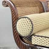 Louis XVI style meridian in carved wood and caning, 19th century.